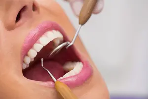 <a href="https://www.freepik.com/free-photo/dentist-examining-female-patient-teeth_8403932.htm#query=dentist&position=27&from_view=search&track=sph">Image by wavebreakmedia_micro</a> on Freepik