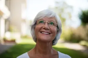 woman with nice smile implant dentistry concept
