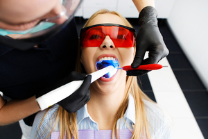 <a href="https://www.freepik.com/free-photo/patient-red-glasses-sits-chair-dentist-office-while-doctor-whiten-her-teeth_1621644.htm#query=tooth%20whitening&position=1&from_view=search">Image by freepic.diller</a> on Freepik